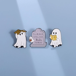 Three-piece Halloween ghost and tombstone enamel pins set on a light blue background