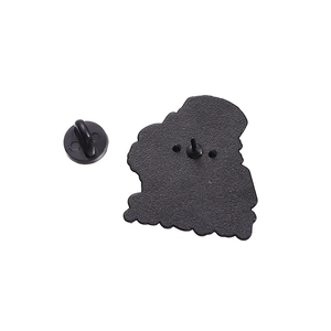 Detail view of the metal brooch back with sandblasted texture and black rubber clutch