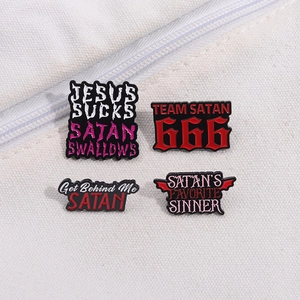 Set of four red horror text enamel pins with Satanic symbols on white canvas background