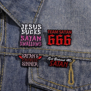 Gothic punk enamel pins with red letters on denim jacket, black metal jewelry set