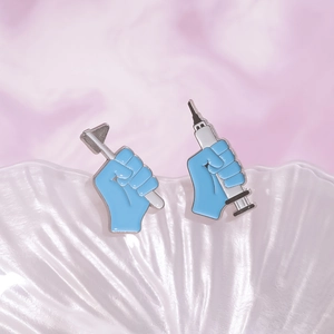 Medical themed enamel pins set featuring a blue syringe and reflex hammer design