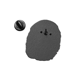 Detail view of the enamel pin back with durable black rubber clutch and metal pin