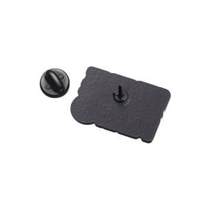 Detail of black enamel pin back with rectangular wavy base and secure rubber clutch