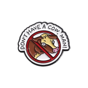Enamel cow pin badge with Don't Have A Cow Man slogan in a red strikeout circle
