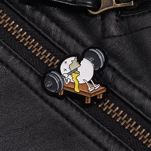 Detail of funny enamel egg barbell pin on black leather jacket showing craftsmanship
