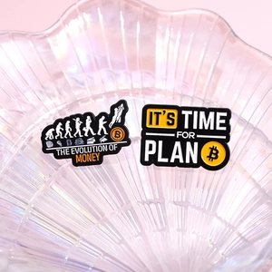 Set of two Bitcoin enamel pins featuring Plan B slogan and currency evolution design