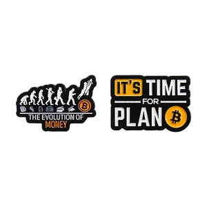 Two-piece bitcoin metal pins set featuring The Evolution of Money and Plan B slogans