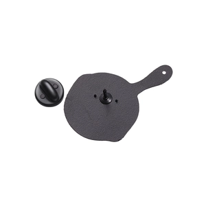 Macro view of matte black enamel pin back and rubber clutch on a plain background