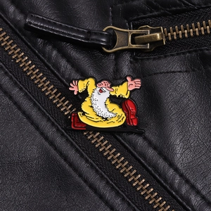 Macro shot of cartoon Mr. Natural enamel pin on black leather jacket with vibrant details