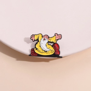 Detailed view of the yellow robe and white beard on the cartoon character enamel pin