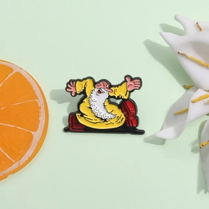 Cartoon enamel pin of a joyful old man in yellow robes with a white beard and red shoes