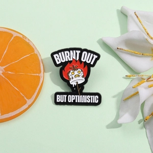 Funny burnt out but optimistic marshmallow enamel pin badge on a green background