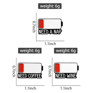 Three enamel battery pins labeled NEED A NAP, COFFEE, WINE with 1.1x0.7 inch dimensions