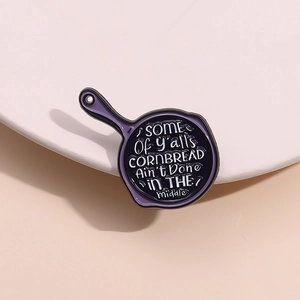 Funny purple frying pan enamel pin with sarcastic cornbread quote for clothing