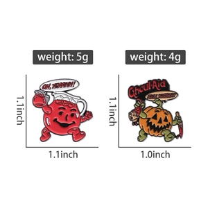 Detail showing weight and size for Halloween pumpkin and Kool-Aid style enamel brooches