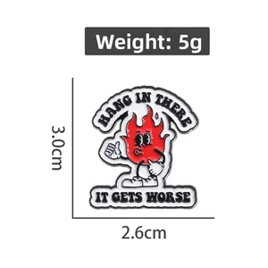 Detail view of flame cartoon enamel pin showing 5g weight and 3.0cm x 2.6cm dimensions