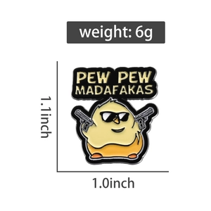 Detailed view of enamel chick pin with sunglasses and guns measuring 1.1 by 1.0 inches