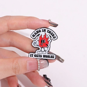 Funny fire enamel pin with Hang in There It Gets Worse text for clothing and bags