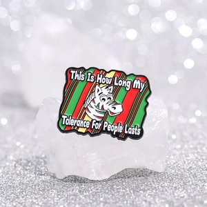 Cartoon zebra enamel pin with colorful stripes and humorous quote on a glittery background