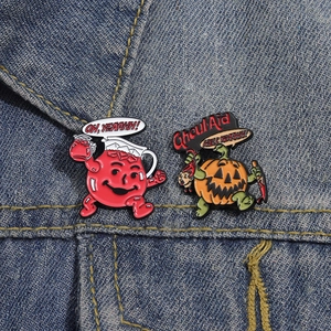 Halloween enamel pin set with red pitcher and pumpkin monster on denim jacket
