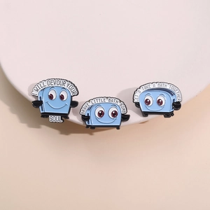 Blue cartoon toaster enamel pin set with humorous English text on a warm pedestal