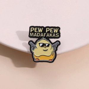 Enamel pin of a yellow chicken with sunglasses holding guns with Pew Pew Madafakas text