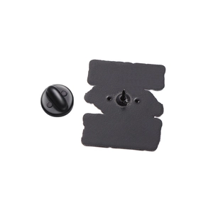 Detail view of the enamel pin's black matte zinc alloy back with a rubber clutch fastener