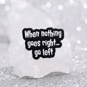 Enamel pin badge with inspirational quote When nothing goes right go left on black cloud