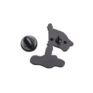 Detail of matte black enamel pin back with secure rubber clutch and textured metal finish