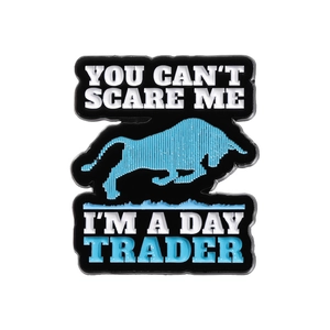 Black enamel pin featuring a blue bull and You Can't Scare Me I'm a Day Trader text