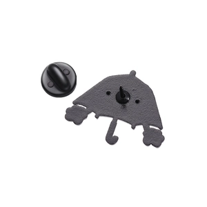 Detailed back view of a metal umbrella enamel pin with black rubber clutch and secure needle