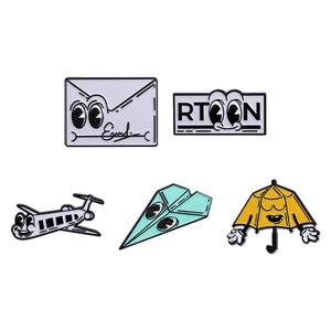 Five-piece cartoon enamel pin set featuring cute airplane, envelope, and umbrella badges