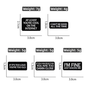 Size chart for black enamel lapel pins with funny quotes and white text engravings