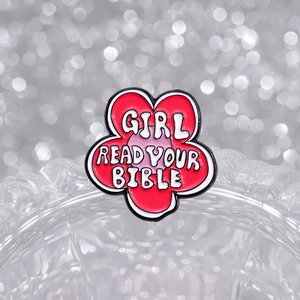 Cartoon flower enamel pin featuring the phrase GIRL READ YOUR BIBLE on red petals