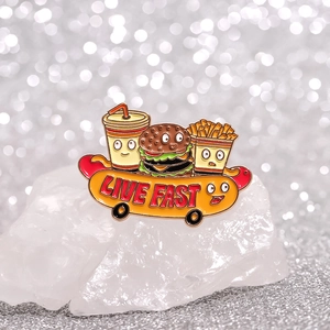 Cartoon fast food enamel pin with burger fries and coke on a skateboard with Live Fast text
