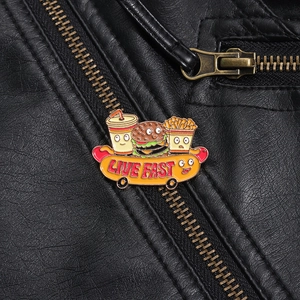 Detail of cartoon fast food enamel pin with Live Fast text on a black leather jacket