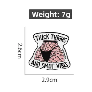Detailed view of enamel pin featuring thick thighs artwork and dimension measurements