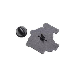 Enamel pin back view with matte metal texture and black rubber clutch fastening