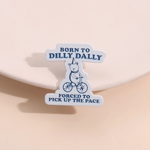 Cartoon bear on bicycle enamel pin badge with Forced to Pick Up the Pace slogan