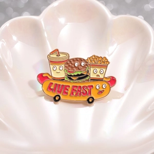 Cartoon fast food enamel pin with hamburger fries and live fast hotdog skateboard design