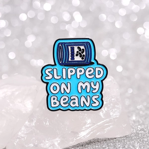 Blue enamel bean can brooch with Slipped On My Beans quote on white crystal base