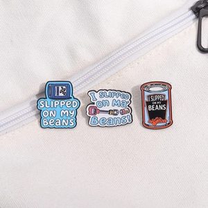 Three-piece set of enamel pins with blue bean can and pop culture quote designs