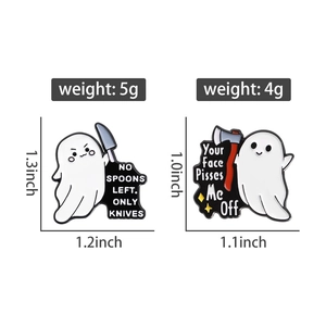 Ghost enamel pins with knife and axe details showing exact size and weight dimensions