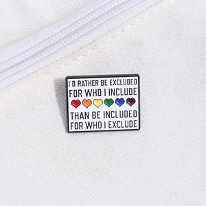 Rainbow heart enamel pin with inspirational quote on white canvas background