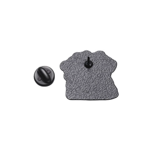 Macro detail of mouse pin back with textured metal finish and black rubber clutch