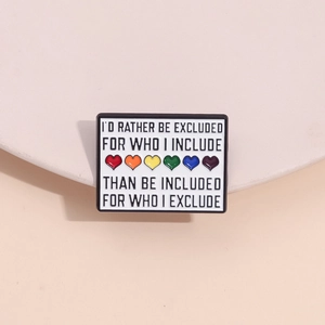 Macro detail of enamel pin with LGBTQ pride rainbow hearts and inspirational slogan
