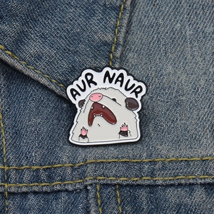Funny cartoon opossum enamel pin with Aur Naur text on blue denim jacket background