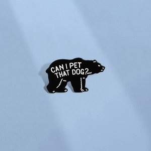 Minimalist black bear enamel pin featuring humorous Can I Pet That Dog text on blue background