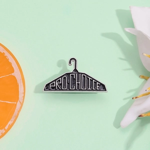 Unique hanger-shaped PRO-CHOICE enamel brooch pin in black and white finish