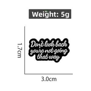 Enamel pin with Don't Look Back quote in black and white, 3.0cm geometric badge